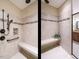 Large walk-in shower with built-in seat and multiple shower heads at 116 Telluride Trl, Garner, NC 27529