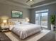 Spacious main bedroom with king-size bed and access to a balcony at 1315 Richfield Oaks Dr, Homesite 3, Fuquay Varina, NC 27526
