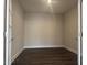 Bright home office features dark wood-look flooring and French doors at 1315 Richfield Oaks Dr, Homesite 3, Fuquay Varina, NC 27526