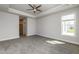 A spacious bedroom features neutral paint, plush carpet, and access to an en-suite bathroom at 134 Oban Dr, Homesite 133, Sanford, NC 27330