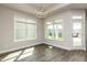 Bright dining area with tray ceilings, chandelier, and large windows providing natural light and outdoors view at 134 Oban Dr, Homesite 133, Sanford, NC 27330