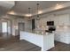 A modern kitchen featuring white cabinets, a large island, and stainless steel appliances at 134 Oban Dr, Homesite 133, Sanford, NC 27330
