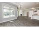Open living area with fireplace, wood floors, light gray walls, and ample natural light from large windows at 134 Oban Dr, Homesite 133, Sanford, NC 27330