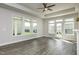 Bright living room with ample natural light, a ceiling fan, and views of the backyard at 134 Oban Dr, Homesite 133, Sanford, NC 27330