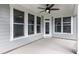 Covered patio area featuring a ceiling fan and multiple windows with screens at 134 Oban Dr, Homesite 133, Sanford, NC 27330