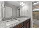 Bathroom boasts double vanity with granite countertop at 1513 Hoke Landing Ln, Raleigh, NC 27603