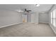 Spacious bedroom with carpeted floors and ceiling fan at 1513 Hoke Landing Ln, Raleigh, NC 27603