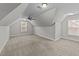 Large bedroom with sloped ceilings and a window at 1513 Hoke Landing Ln, Raleigh, NC 27603