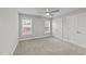 Bright bedroom featuring two windows and double closets at 1513 Hoke Landing Ln, Raleigh, NC 27603