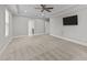 Main bedroom with ceiling fan and en-suite bathroom at 1513 Hoke Landing Ln, Raleigh, NC 27603