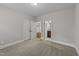 Spacious bedroom with plush carpeting and access to hallway bath at 1513 Hoke Landing Ln, Raleigh, NC 27603