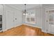 Bright breakfast area with hardwood floors and view to backyard at 1513 Hoke Landing Ln, Raleigh, NC 27603