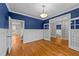 Hardwood floors, blue walls, and white wainscoting at 1513 Hoke Landing Ln, Raleigh, NC 27603