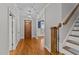Hardwood floors, wooden staircase, and neutral colors at 1513 Hoke Landing Ln, Raleigh, NC 27603