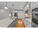Spacious kitchen boasts granite countertops and stainless steel appliances at 1513 Hoke Landing Ln, Raleigh, NC 27603