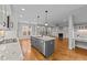 Island kitchen with granite countertops and stainless steel appliances at 1513 Hoke Landing Ln, Raleigh, NC 27603