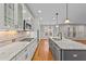 Modern kitchen features granite countertops and white cabinets at 1513 Hoke Landing Ln, Raleigh, NC 27603