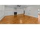 Living room with hardwood floors, built-in shelves, and fireplace at 1513 Hoke Landing Ln, Raleigh, NC 27603