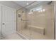 Spacious shower with glass enclosure and built-in seat at 1513 Hoke Landing Ln, Raleigh, NC 27603