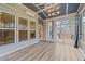 Bright sunroom features tons of windows and access to backyard at 1513 Hoke Landing Ln, Raleigh, NC 27603