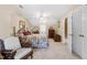 Inviting bedroom with floral bedspread, a wooden accent chair, and soft carpeting at 1741 W Blackman Rd, Dunn, NC 28334