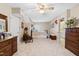Large bedroom features wooden furniture, an accent chair, and an attached bathroom at 1741 W Blackman Rd, Dunn, NC 28334