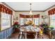 Cozy dining room with large bay window, and tile flooring at 1741 W Blackman Rd, Dunn, NC 28334