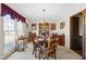 Formal dining room featuring a classic chandelier, a large window and seating for eight at 1741 W Blackman Rd, Dunn, NC 28334