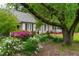 Charming home with black shutters, landscaped gardens, and inviting front porch at 1741 W Blackman Rd, Dunn, NC 28334