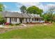 Beautiful one-story home with a classic covered porch and vibrant landscaping at 1741 W Blackman Rd, Dunn, NC 28334