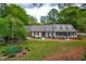 Charming home featuring dormer windows, a covered front porch, and a well-manicured front yard at 1741 W Blackman Rd, Dunn, NC 28334