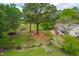 Spacious front yard featuring mature trees, lush greenery, and inviting curb appeal at 1741 W Blackman Rd, Dunn, NC 28334