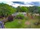 Scenic front yard view, showing a well-manicured lawn and mature landscaping that frames a charming home at 1741 W Blackman Rd, Dunn, NC 28334
