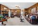 Living room with brick fireplace, wood paneling and leather furniture at 1741 W Blackman Rd, Dunn, NC 28334