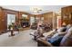 Inviting living room features a fireplace, wood paneling, and plush seating at 1741 W Blackman Rd, Dunn, NC 28334