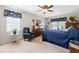 Bright bedroom featuring neutral walls, carpet, ceiling fan, and a classic style bed at 1741 W Blackman Rd, Dunn, NC 28334