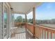 Covered patio featuring wood flooring and railing with views of the backyard at 189 Sunrise Ridge Dr, Willow Springs, NC 27592