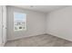 Bright bedroom featuring carpeted floors and a large window at 203 Shelfit Trl, Oxford, NC 27565