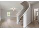 Bright living room with hardwood floors and access to a half-bathroom at 207 Shelfit Trl, Oxford, NC 27565