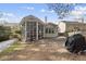 House exterior view showcasing a sunroom and backyard at 208 Trailview Dr, Cary, NC 27513