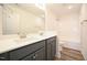 Modern bathroom features a double sink vanity and a shower-tub combination at 223 Johnson Ridge Way, Four Oaks, NC 27524
