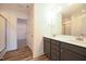 En-suite bathroom with double vanity, shower with glass door, and walk-in closet access at 223 Johnson Ridge Way, Four Oaks, NC 27524