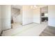 Bright dining room showcasing elegant wainscoting, stylish lighting, and beautiful staircase at 223 Johnson Ridge Way, Four Oaks, NC 27524