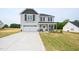 Charming two-story home with a two-car garage and manicured front yard at 223 Johnson Ridge Way, Four Oaks, NC 27524