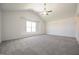 Large main bedroom featuring vaulted ceiling, ceiling fan, and large window at 223 Johnson Ridge Way, Four Oaks, NC 27524