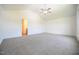 Spacious main bedroom featuring vaulted ceiling, ceiling fan, and en-suite bathroom access at 223 Johnson Ridge Way, Four Oaks, NC 27524