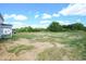Expansive backyard with a tree-lined view, grassy areas, and a serene atmosphere at 236 Johnson Ridge Way, Four Oaks, NC 27524