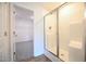 Bathroom featuring glass shower door, white shower, and tile accents at 236 Johnson Ridge Way, Four Oaks, NC 27524