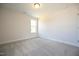 A bright, carpeted bedroom featuring neutral walls and one window for ample natural light at 236 Johnson Ridge Way, Four Oaks, NC 27524