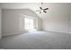 Large bedroom featuring a vaulted ceiling and fan at 236 Johnson Ridge Way, Four Oaks, NC 27524